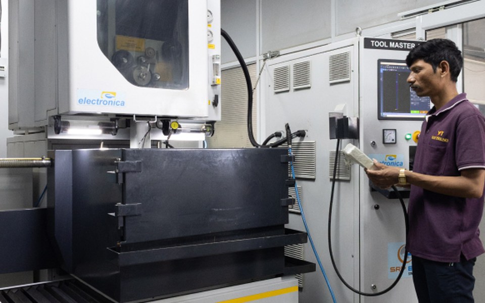 Toolmaker operating precision EDM and CNC equipment